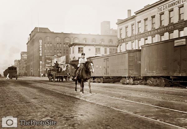 Boy on horse, railroad cars 11th Ave New York City - Click Image to Close