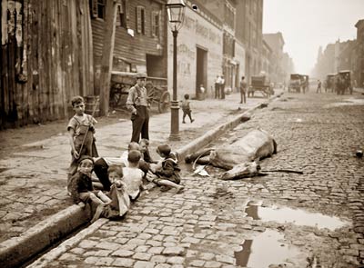 Dead horse, cobbled street, children playing in New York