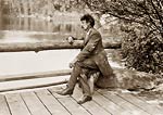 Ernest Thompson Seton portrait, sat on a bench